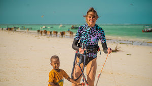 Surfing apparel collection  featuring a young surf girl managing her kite